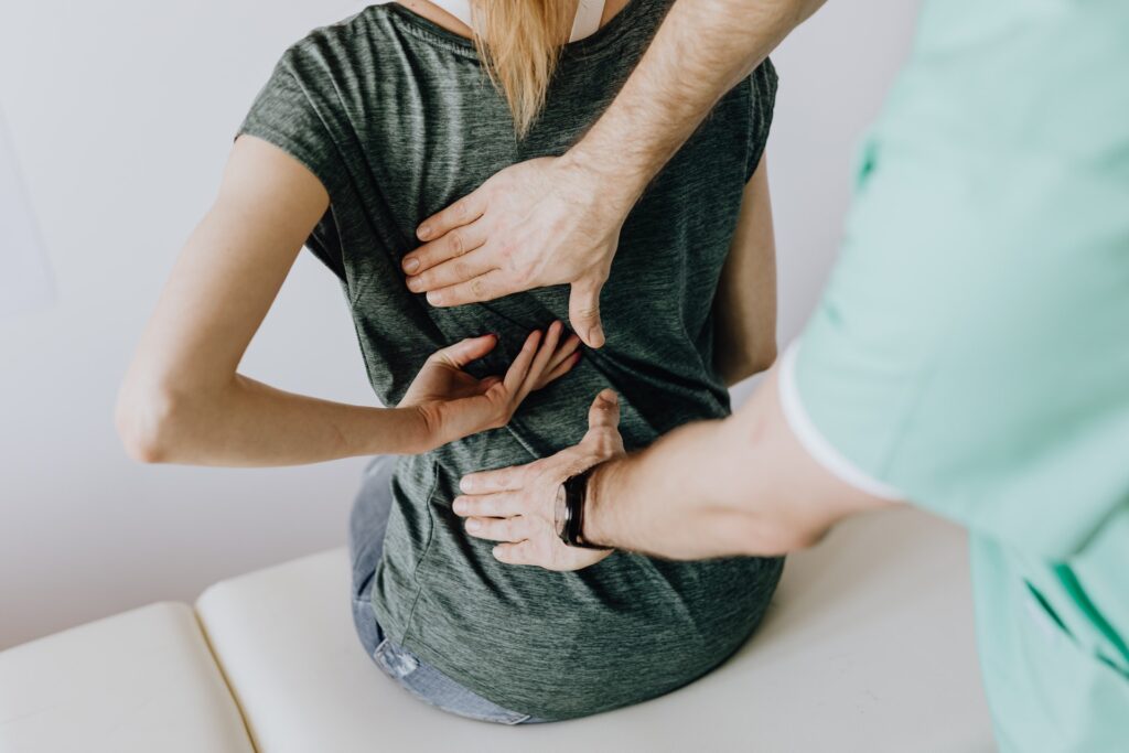 woman undergoing back pain massage